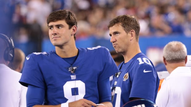 Aug 16, 2019; East Rutherford, NJ, USA; New York Giants quarterback Daniel Jones (8) looks on with quarterback Eli Manning (10) during the second half against the Chicago Bears at MetLife Stadium.