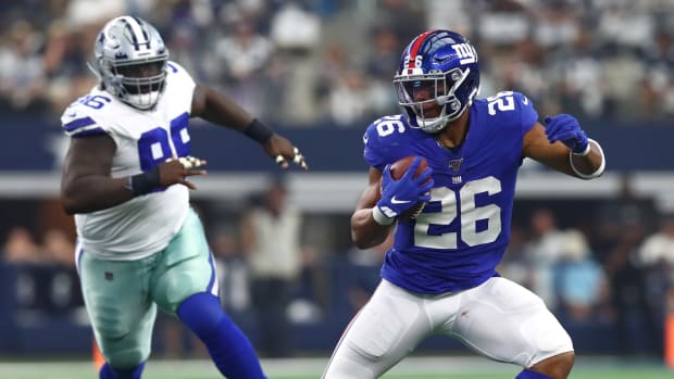 Sep 8, 2019; Arlington, TX, USA; New York Giants running back Saquon Barkley (26) runs with the ball against the Dallas Cowboys at AT&T Stadium.