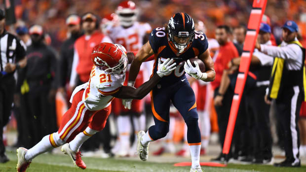 Oct 1, 2018; Denver, CO, USA; Denver Broncos running back Phillip Lindsay (30) carries the ball against Kansas City Chiefs cornerback Eric Murray (21) in the third quarter against the at Broncos Stadium at Mile High.