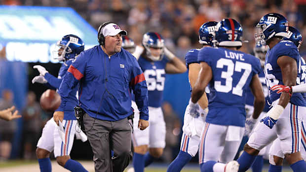 Aug 16, 2019; East Rutherford, NJ, USA; New York Giants defensive coordinator James Bettcher celebrates with players during the first half against the Chicago Bears at MetLife Stadium.