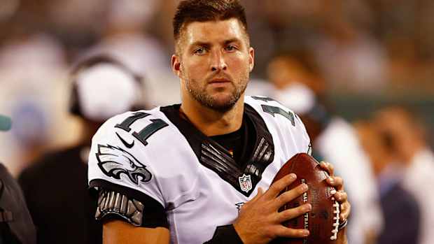 tim-tebow-football-baseball.jpg