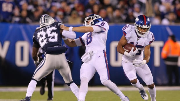 Nov 4, 2019; East Rutherford, NJ, USA; New York Giants quarterback Daniel Jones (8) blocks Dallas Cowboys safety Xavier Woods (25) as New York Giants wide receiver Golden Tate (15) runs the ball during the second quarter at MetLife Stadium.