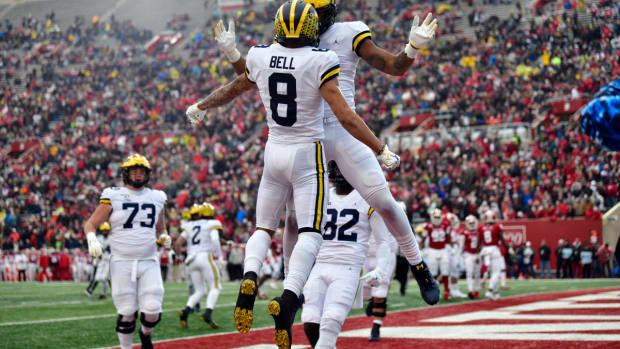 Michigan Wolverines wide receiver Ronnie Bell (8) celebrates a touchdown with his teammates during the first quarter of the game against the Indiana Hoosiers at Memorial Stadium