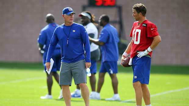 Jul 26, 2018; East Rutherford, NJ, USA; New York Giants head coach Pat Shurmur talks with quarterback Eli Manning (10) during training camp at Quest Diagnostics Training Center.