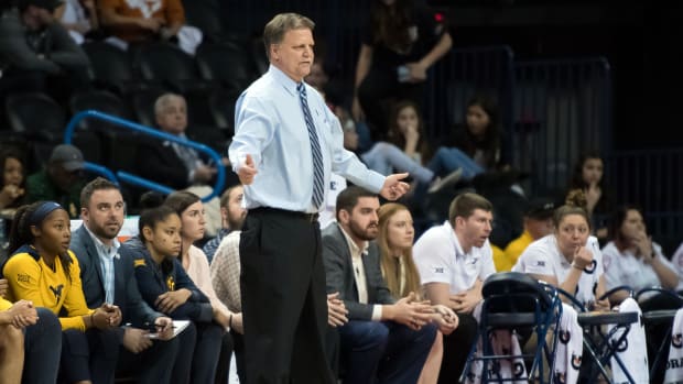 West Virginia Mountaineers head coach Mike Carey reacts during the game against the Texas Longhorns during the women's Big 12 Conference Tournament at Chesapeake Energy Arena