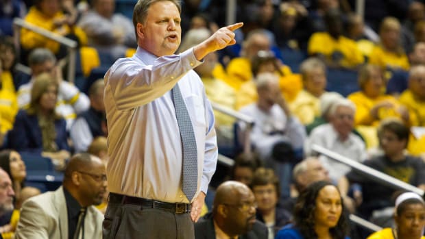 West Virginia Mountaineers head coach Mike Carey reacts on the sidelines during the second half against the Baylor Bears at WVU Coliseum.