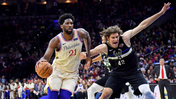 Dec 25, 2019; Philadelphia, Pennsylvania, USA; Philadelphia 76ers center Joel Embiid (21) drives to the basket against Milwaukee Bucks center Robin Lopez (42) during the second quarter at Wells Fargo Center. Mandatory Credit: Eric Hartline-USA TODAY Sports