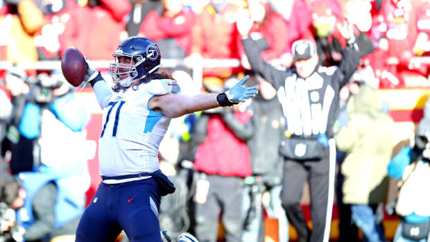 Tennessee Titans offensive tackle Dennis Kelly (71) celebrates after scoring a touchdown during the first half against the Kansas City Chiefs in the AFC Championship Game at Arrowhead Stadium.