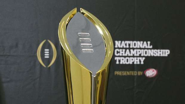 1405452111000-USP-NCAA-FOOTBALL-NATIONAL-CHAMPIONSHIP-TROPHY-UN-65838024