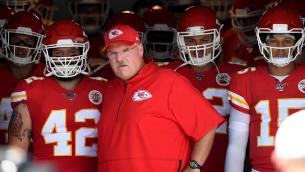 Sep 8, 2019; Jacksonville, FL, USA; Kansas City Chiefs running back Anthony Sherman (42) and head coach Andy Reid (red hat) and quarterback Patrick Mahomes (15) wait to enter the field prior to the game against the Jacksonville Jaguars at TIAA Bank Field. Mandatory Credit: Douglas DeFelice-USA TODAY Sports