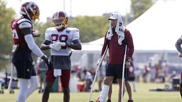 Alex Smith Crutches © Geoff Burke-USA TODAY Sports