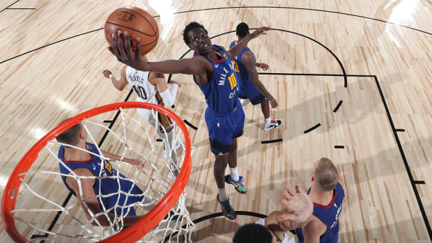 Bol Bol of the Nuggets grabs the rebound against the Pelicans