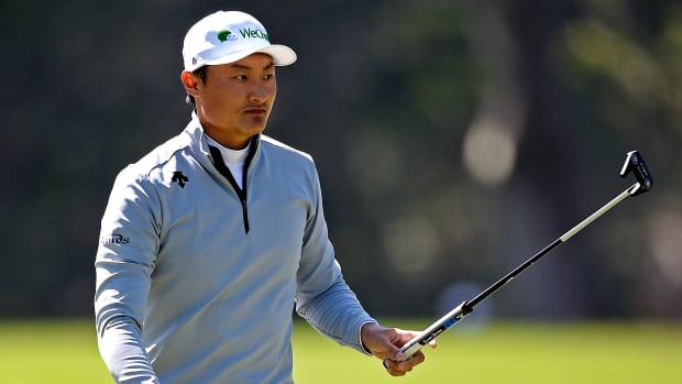 Haotong Li reacts to his putt on the 14th green during the second round of the 2020 PGA Championship golf tournament at TPC Harding Park.