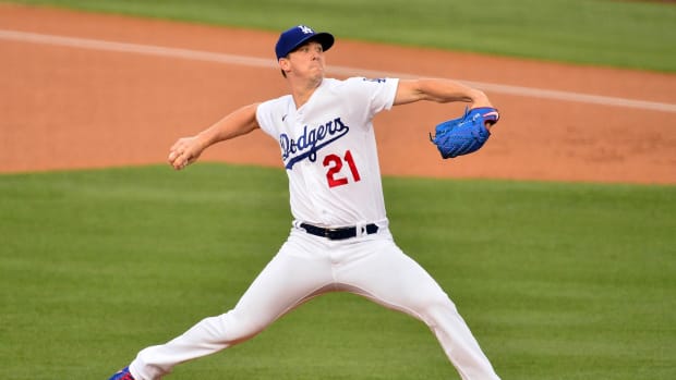 August 21, 2020; Los Angeles, California, USA; Los Angeles Dodgers starting pitcher Walker Buehler (21) throws against the Colorado Rockies during the first inning against the Colorado Rockies at Dodger Stadium. Mandatory Credit: Gary A. Vasquez-USA TODAY Sports