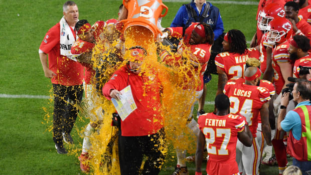Feb 2, 2020; Miami Gardens, Florida, USA; Kansas City Chiefs head coach Andy Reid is dunked with Gatorade by his players Jordan Lucas (24) and Cameron Erving (75) in the fourth quarter in Super Bowl LIV against the San Francisco 49ers at Hard Rock Stadium. Mandatory Credit: Steve Mitchell-USA TODAY Sports