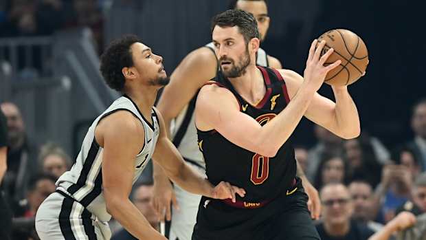 Cleveland Cavaliers forward Kevin Love (0) holds the ball as San Antonio Spurs guard Bryn Forbes (11) defends during the first half at Rocket Mortgage FieldHouse.