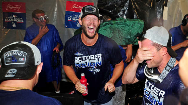 Sep 10, 2019; Baltimore, MD, USA; Los Angeles Dodgers pitcher Clayton Kershaw (center) celebrates after clinching the NL West division after defeating the Baltimore Orioles at Oriole Park at Camden Yards. Mandatory Credit: Evan Habeeb-USA TODAY Sports