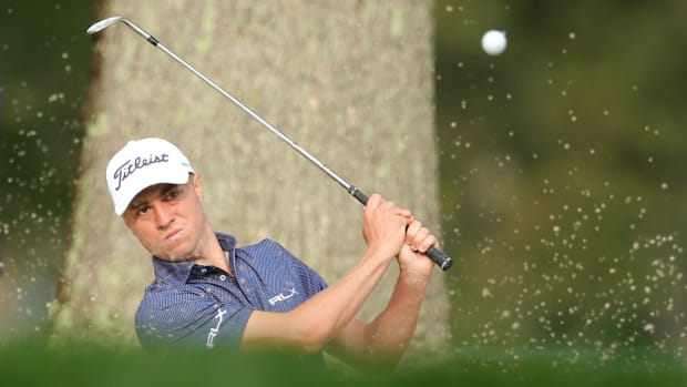 Justin Thomas hits out of a sand trap onto the 3rd green during the first round of the U.S. Open golf tournament at Winged Foot Golf Club - West.