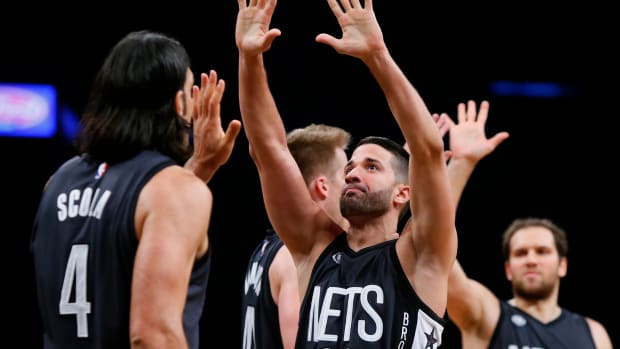 Oct 28, 2016; Brooklyn, NY, USA; Brooklyn Nets guard Greivis Vasquez (21) and forward Luis Scola (4) react after leading in the fourth quarter against the Indiana Pacers during second half at Barclays Center. The Nets won 103-94.Mandatory Credit: Noah K. Murray-USA TODAY Sports