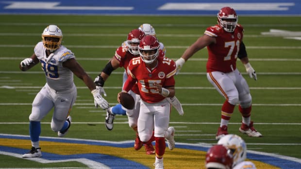 Sep 20, 2020; Inglewood, California, USA; Kansas City Chiefs quarterback Patrick Mahomes (15) runs the ball against the Los Angeles Chargers during the fourth quarter at SoFi Stadium. Mandatory Credit: Robert Hanashiro-USA TODAY Sports