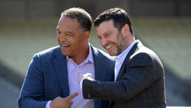 Feb 12, 2020; Los Angeles, California, USA; Los Angeles Dodgers manager Dave Roberts (left) and president of baseball operations Andrew Friedman react during a press conference at Dodger Stadium. Mandatory Credit: Kirby Lee-USA TODAY Sports