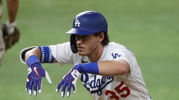 Oct 6, 2020; Arlington, Texas, USA; Los Angeles Dodgers center fielder Cody Bellinger (35) celebrates after hitting a one run single off of San Diego Padres relief pitcher Matt Strahm (not pictured) during the sixth inning in game one of the 2020 NLDS at Globe Life Field. Mandatory Credit: Tim Heitman-USA TODAY Sports