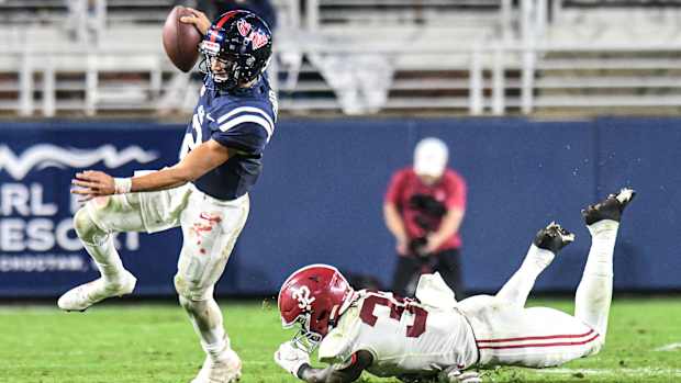 Ole Miss quarterback Matt Corral (2) avoids Alabama linebacker Dylan Moses (32) at Vaught-Hemingway Stadium in Oxford, Miss. on Saturday, October 10, 2020. (Bruce Newman)