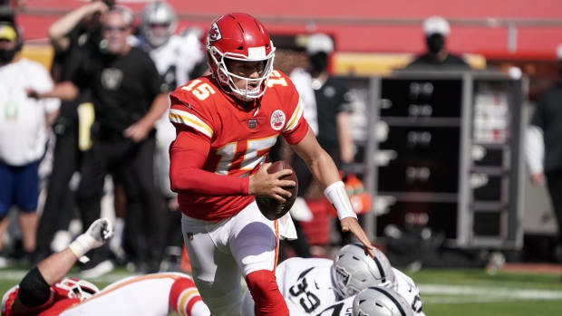 Oct 11, 2020; Kansas City, Missouri, USA; Kansas City Chiefs quarterback Patrick Mahomes (15) throws the ball in the second quarter against the Las Vegas Raiders at Arrowhead Stadium. Mandatory Credit: Kirby Lee-USA TODAY Sports
