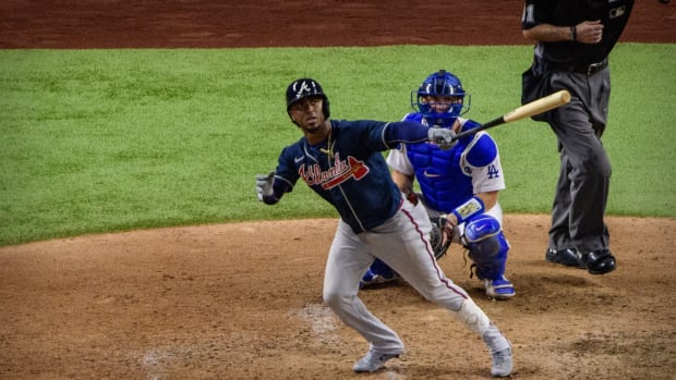 Oct 12, 2020; Arlington, Texas, USA; Atlanta Braves second baseman Ozzie Albies (1) hits a home run against the Los Angeles Dodgers in the ninth inning during game one of the 2020 NLCS at Globe Life Field. Mandatory Credit: Jerome Miron-USA TODAY Sports