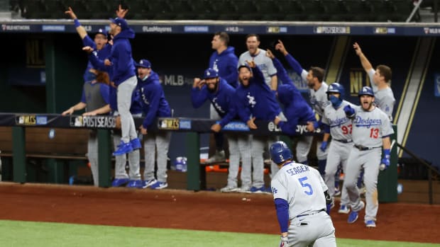 Oct 16, 2020; Arlington, Texas, USA; Los Angeles Dodgers shortstop Corey Seager (5) celebrates his two run homerun against the Atlanta Braves during the seventh inning in game five of the 2020 NLCS at Globe Life Field. Mandatory Credit: Kevin Jairaj-USA TODAY Sports