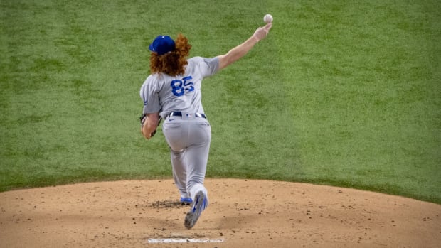 Oct 16, 2020; Arlington, Texas, USA; Los Angeles Dodgers starting pitcher Dustin May (85) pitches to the Atlanta Braves during the first inning in game five of the 2020 NLCS at Globe Life Field. Mandatory Credit: Jerome Miron-USA TODAY Sports