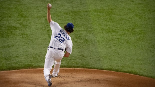 Oct 20, 2020; Arlington, Texas, USA; Los Angeles Dodgers starting pitcher Clayton Kershaw (22) pitches against the Tampa Bay Rays during the first inning in game one of the 2020 World Series at Globe Life Field. Mandatory Credit: Jerome Miron-USA TODAY Sports