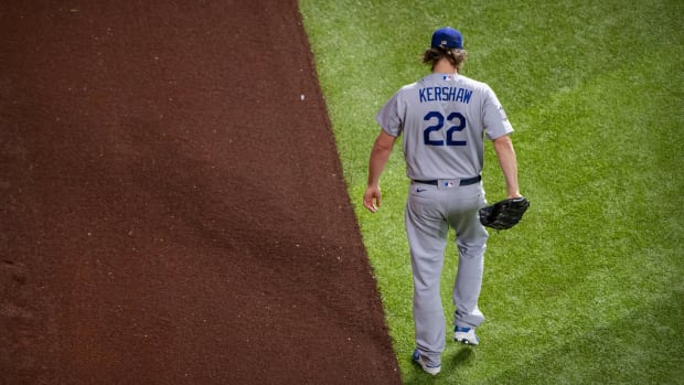 Oct 25, 2020; Arlington, Texas, USA; Los Angeles Dodgers starting pitcher Clayton Kershaw (22) warms up before the game between the Tampa Bay Rays and the Los Angeles Dodgers in game five of the 2020 World Series at Globe Life Field. Mandatory Credit: Jerome Miron-USA TODAY Sports