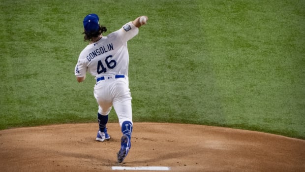 Oct 21, 2020; Arlington, Texas, USA; Los Angeles Dodgers starting pitcher Tony Gonsolin (46) pitches against the Tampa Bay Rays during the first inning in game two of the 2020 World Series at Globe Life Field. Mandatory Credit: Jerome Miron-USA TODAY Sports