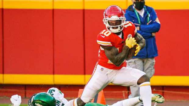 Nov 1, 2020; Kansas City, Missouri, USA; Kansas City Chiefs wide receiver Tyreek Hill (10) catches a touchdown pass as New York Jets cornerback Quincy Wilson (31) defends during the second half at Arrowhead Stadium. Mandatory Credit: Jay Biggerstaff-USA TODAY Sports