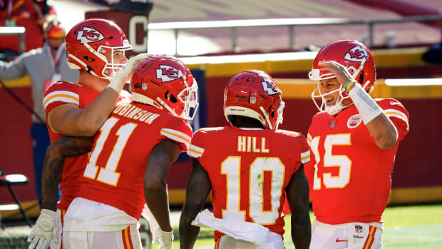Nov 1, 2020; Kansas City, Missouri, USA; Kansas City Chiefs wide receiver Demarcus Robinson (11) is congratulated by quarterback Patrick Mahomes (15) and tight end Nick Keizer (48) and wide receiver Tyreek Hill (10) after scoring a touchdown against the New York Jets during the second half at Arrowhead Stadium. Mandatory Credit: Jay Biggerstaff-USA