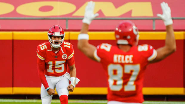 Oct 5, 2020; Kansas City, Missouri, USA; Kansas City Chiefs quarterback Patrick Mahomes (15) takes the field with tight end Travis Kelce (87) before the game New England Patriots at Arrowhead Stadium. Mandatory Credit: Jay Biggerstaff-USA TODAY Sports