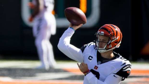 Cincinnati Bengals quarterback Joe Burrow (9) throws a pass while warming up before the Cincinnati Bengals and Tennessee Titans on Sunday, Nov. 1, 2020, in Cincinnati.
