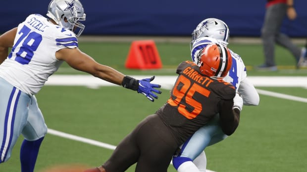 Oct 4, 2020; Arlington, Texas, USA; Dallas Cowboys quarterback Dak Prescott (4) is sacked by Cleveland Browns defensive end Myles Garrett (95) in the first quarter at AT&T Stadium. Mandatory Credit: Tim Heitman-USA TODAY Sports
