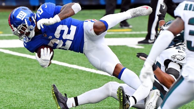 Nov 15, 2020; East Rutherford, New Jersey, USA; New York Giants running back Wayne Gallman (22) is tackled as he makes a first down against the Philadelphia Eagles during the second half at MetLife Stadium.