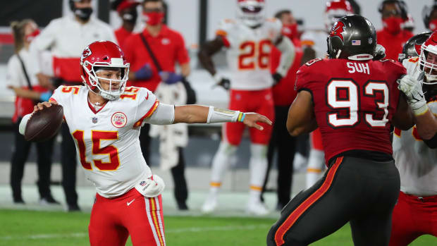 Nov 29, 2020; Tampa, Florida, USA; Kansas City Chiefs quarterback Patrick Mahomes (15) throws as Tampa Bay Buccaneers defensive end Ndamukong Suh (93) moves in during the first half at Raymond James Stadium. Mandatory Credit: Kim Klement-USA TODAY Sports