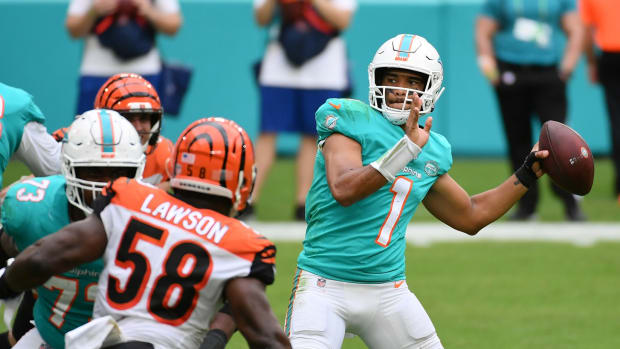 Dec 6, 2020; Miami Gardens, Florida, USA; Miami Dolphins quarterback Tua Tagovailoa (1) attempts a pass against the Cincinnati Bengals during the second half at Hard Rock Stadium. Mandatory Credit: Jasen Vinlove-USA TODAY Sports