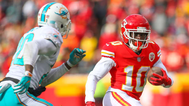 Dec 24, 2017; Kansas City, MO, USA; Kansas City Chiefs wide receiver Tyreek Hill (10) runs against Miami Dolphins safety Reshad Jones (20) in the first half at Arrowhead Stadium. Mandatory Credit: Jay Biggerstaff-USA TODAY Sports