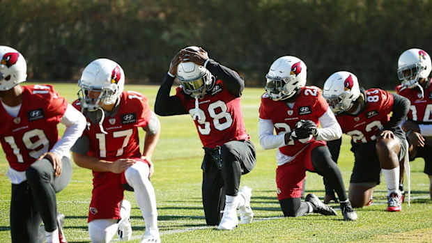 Dec 9, Tempe, Arizona, USA; Arizona Cardinals running back Jonathan Ward (38) adjusts his helmet during practice at Dignity Health Training Facility.