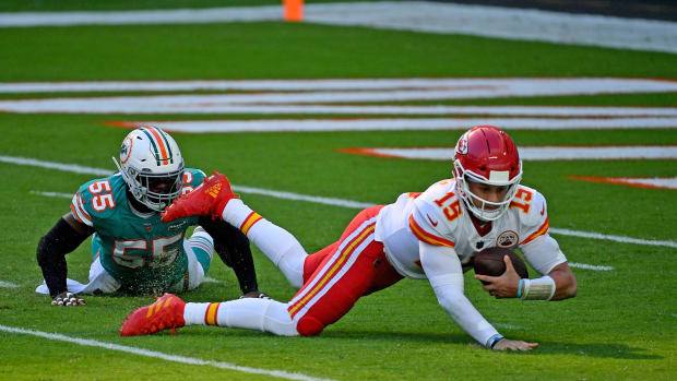 Dec 13, 2020; Miami Gardens, Florida, USA; Miami Dolphins outside linebacker Jerome Baker (55) sacks Kansas City Chiefs quarterback Patrick Mahomes (15) during the first half at Hard Rock Stadium. Mandatory Credit: Jasen Vinlove-USA TODAY Sports