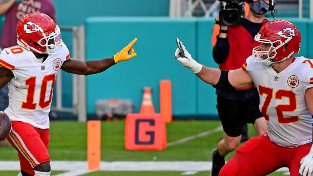 Dec 13, 2020; Miami Gardens, Florida, USA; Kansas City Chiefs wide receiver Tyreek Hill (10) celebrates his touchdown against the Miami Dolphins with offensive tackle Eric Fisher (72) during the second half at Hard Rock Stadium. Mandatory Credit: Jasen Vinlove-USA TODAY Sports