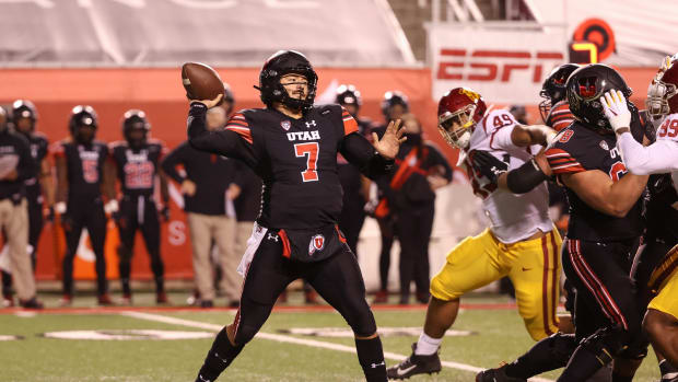 Nov 21, 2020; Salt Lake City, Utah, USA; Utah Utes quarterback Cameron Rising (7) throws the ball down the field against the USC Trojans during the first quarter at Rice-Eccles Stadium.