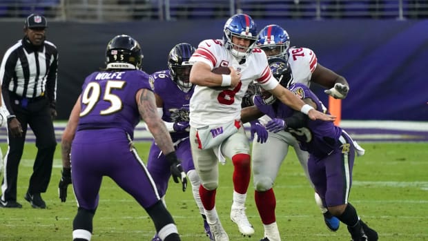 Dec 27, 2020; Baltimore, Maryland, USA; New York Giants quarterback Daniel Jones sacked in the fourth quarter by Baltimore Ravens defense at M&T Bank Stadium.