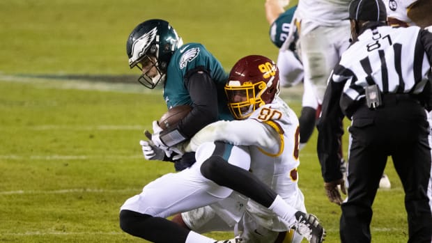 Jan 3, 2021; Philadelphia, Pennsylvania, USA; Washington Football Team defensive end Montez Sweat (90) sacks Philadelphia Eagles quarterback Nate Sudfeld (7) during the fourth quarter at Lincoln Financial Field.