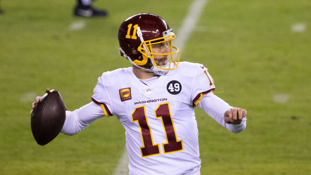 Jan 3, 2021; Philadelphia, Pennsylvania, USA; Washington Football Team quarterback Alex Smith (11) passes the ball against the Philadelphia Eagles during the third quarter at Lincoln Financial Field.